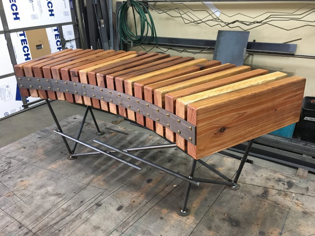 wooden table with steel elements by Molotov MetalWorks